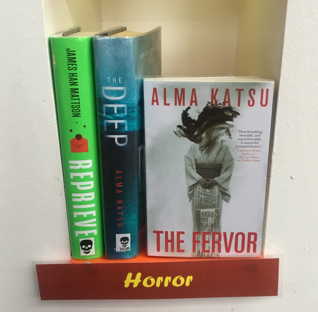Photo showing a shelf of selected Horror Books by ESEA authors available at Palmers Green Library