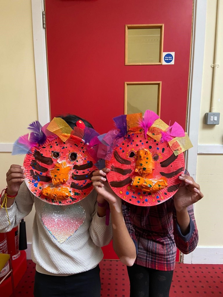Two children in their crafted African masks